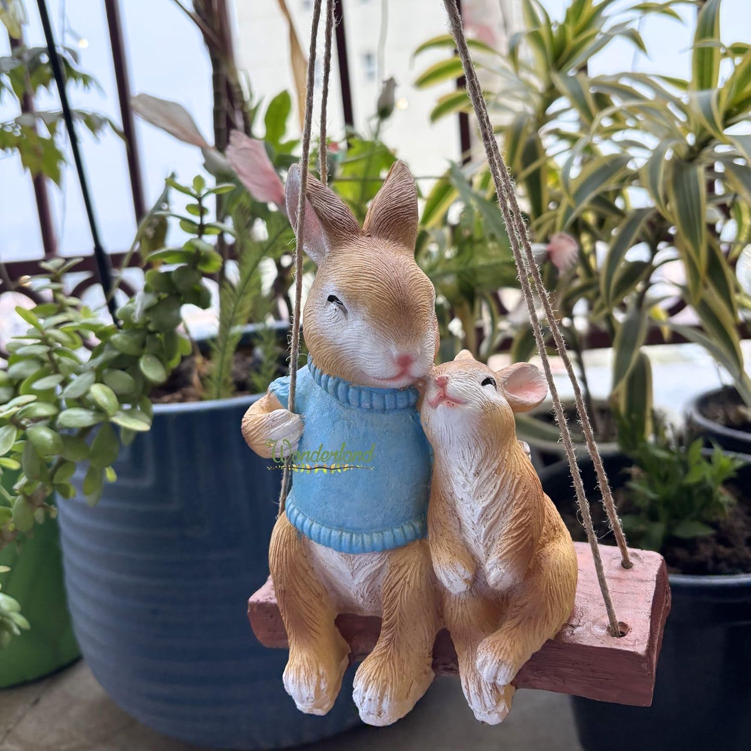 817WMgcltL._SL1500_.jpg Wonderland Whimsical Hanging Garden Bunny Statue – Hand-Painted Rabbit Mother and Baby on Swing for Patio, Balcony, and Indoor Home Decor - Image 1
